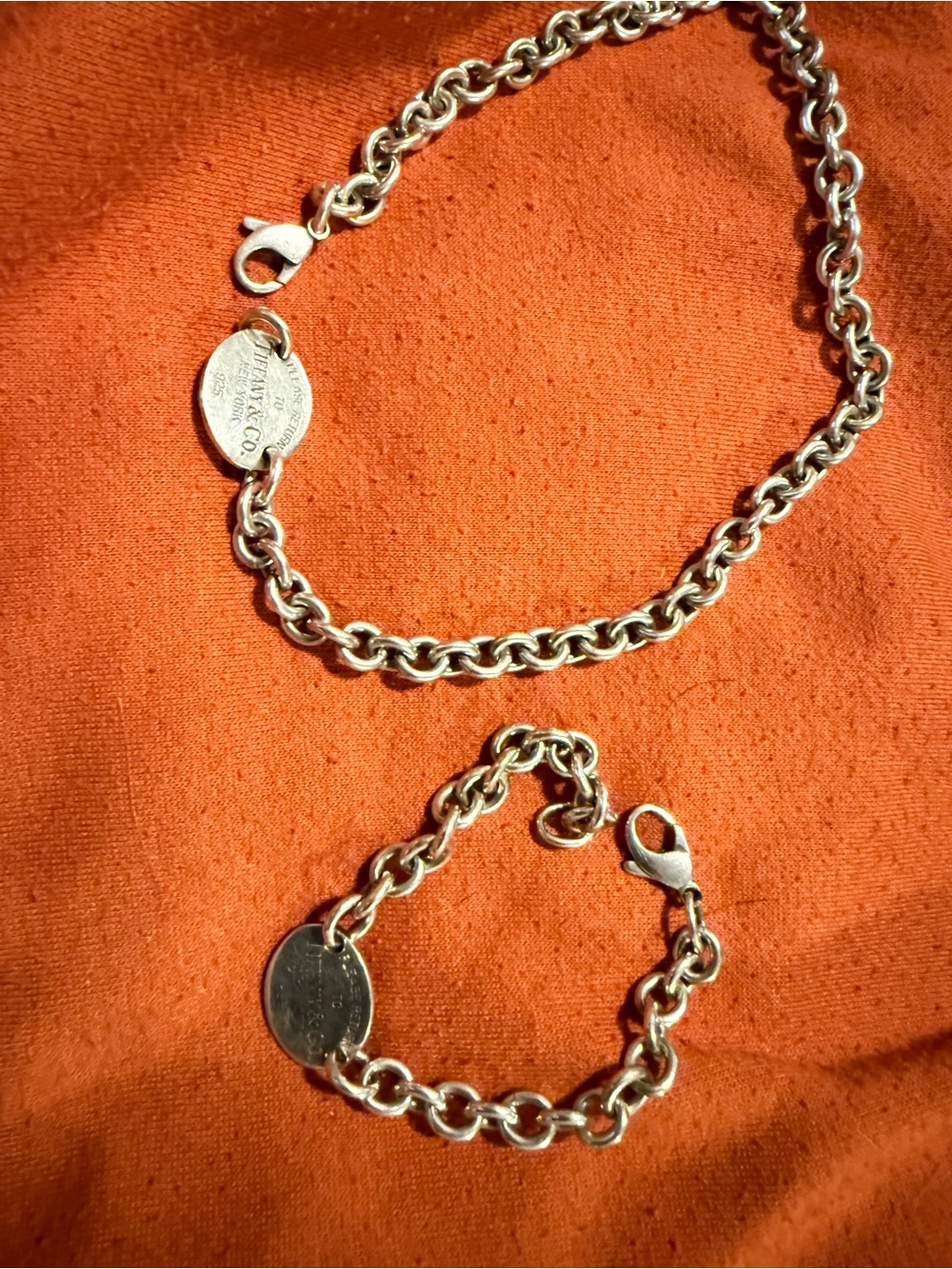 Tiffany & Co. sterling silver necklace and matching bracelet.